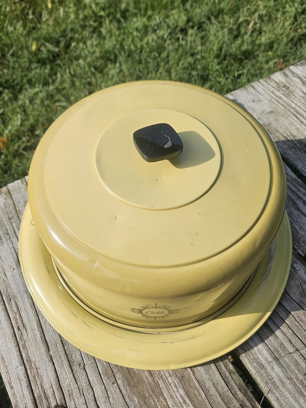 Yellow Cake Keeper with Decorative Emblem